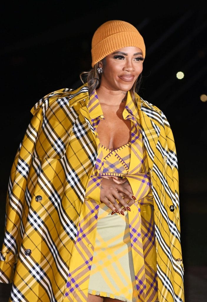 Tiwa Savage posing at a brand event