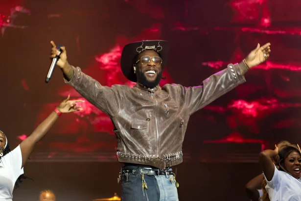 Burna Boy performing at Madison Square Garden representing his $22 million net worth from touring and streaming