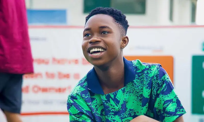 Peller net worth showing young Nigerian TikTok creator with smartphone and digital earnings symbols