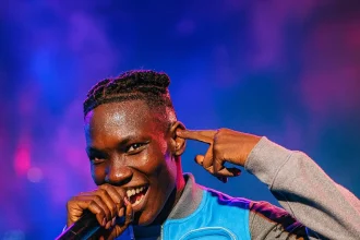 Zinoleesky performing live showing his rise to wealth and success in Nigerian music industry